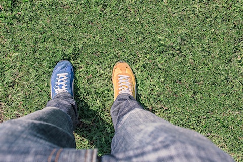 Odd shoes on grass