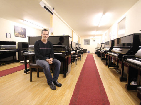 Mark Goodwin in his Manchester piano showroom